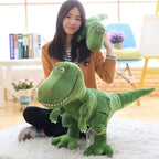 Plus dinosaur toy held by girl with another toy dinosaur on her shoulder in cozy indoor setting