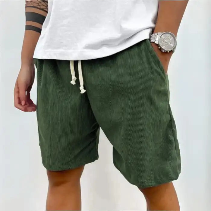 Plus Size Men's Corduroy Shorts in green, elastic drawstring waistband and pockets shown with casual white top.