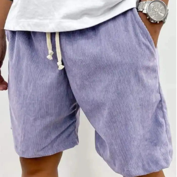 Plus Size Men's Corduroy Shorts in lilac purple with drawstring waist and pockets worn with plain white shirt.