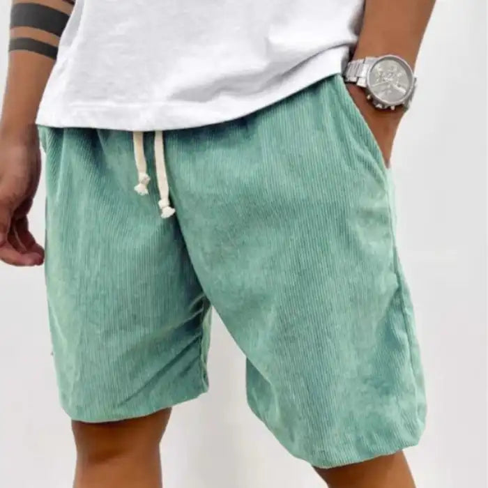  Plus Size Men's Corduroy Shorts in mint green featuring drawstring waistband and pockets styled with white shirt.