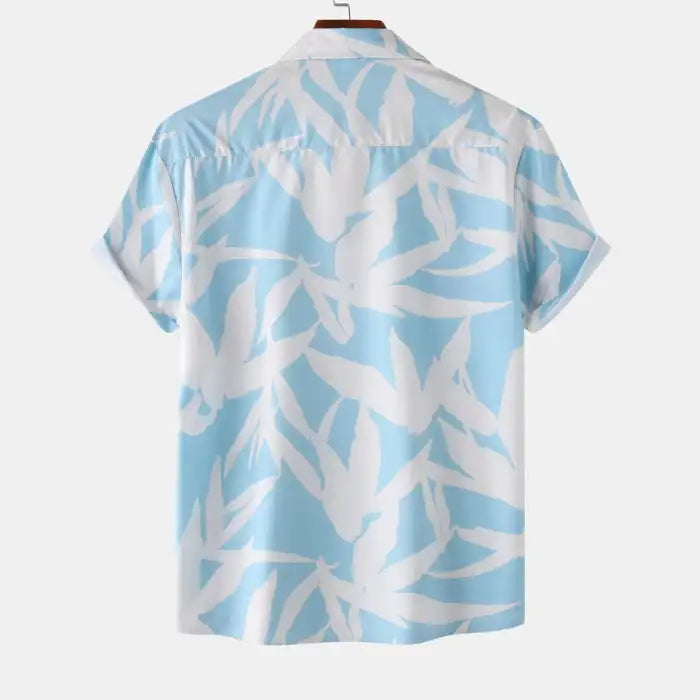Back view of plus size men's printed short sleeve shirt in blue and white leaf design