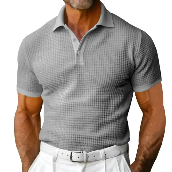 Plus size gray polo shirt on a male model featuring short sleeves and waffle texture.