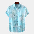 Plus size tropical shirt for men in light blue with floral patterns and short sleeves front view.