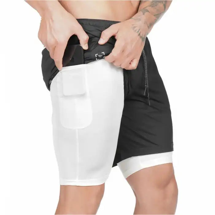  Black and white pocket compression shorts designed for athletic use with visible phone pouch.