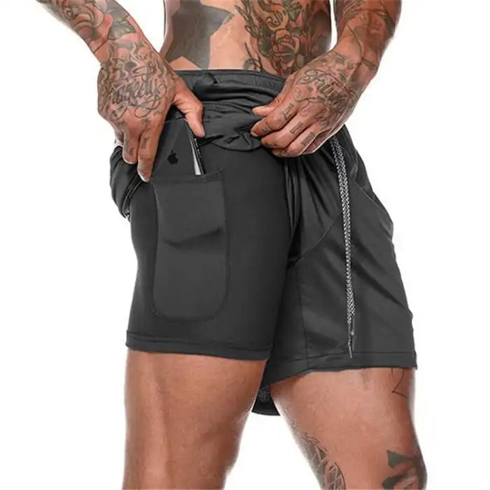  Dual-layer black pocket compression shorts with mesh outer layer and secure inner phone pocket.