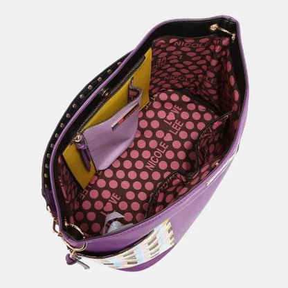 Spacious handbag interior showing polka dot lining, multiple compartments, and zip pockets for organized storage