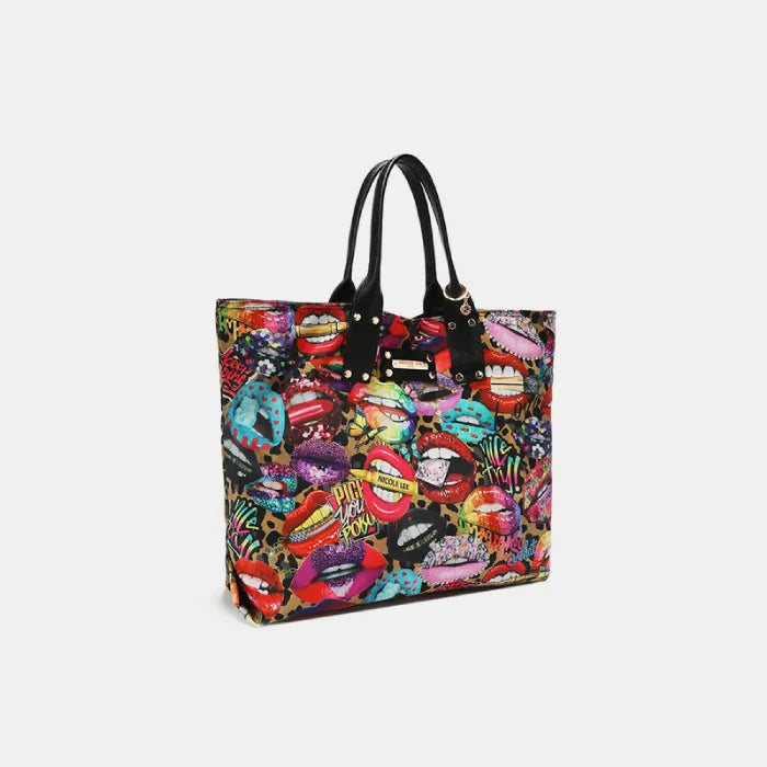 Side view of tote bag featuring colorful pop art lip designs, black leather trim, and gold-tone logo plate