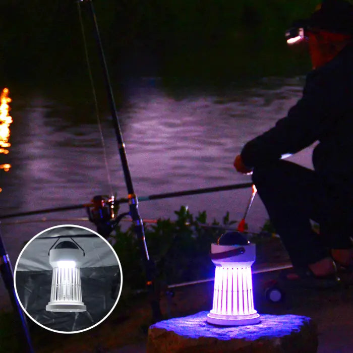 portable bug zapper glowing near a fishing spot, ideal for camping and outdoor use.