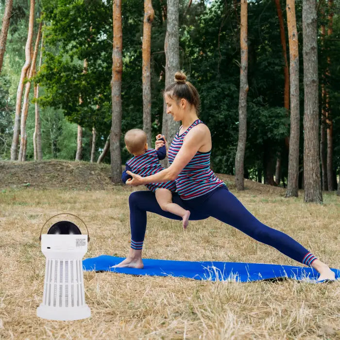 portable bug zapper placed in a forest setting, ensuring a mosquito-free outdoor experience.