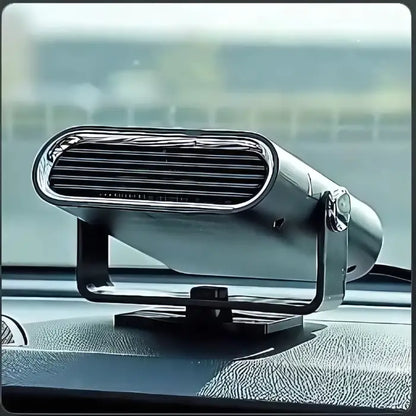 Sleek silver portable heater with oval grille mounted on car dashboard, adjustable stand, against blurred car interior background