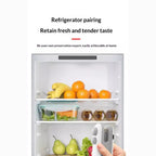 Portable mini bag sealer with magnetic storage shown in refrigerator for fresh food preservation at home.