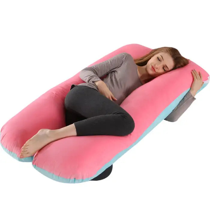 Double-sided pink and blue pregnancy pillow with ergonomic support for restful side sleeping.