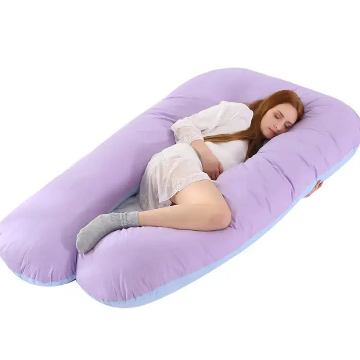Light purple pregnancy pillow shaped to fit body curves for maternity and postnatal comfort.
