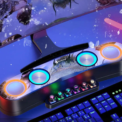 Gaming device with colorful illuminated buttons and speakers, displaying various audio and connectivity features