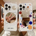 Protective iPhone 15 case featuring colorful space-themed designs with planets, rockets and cosmic elements on clear background