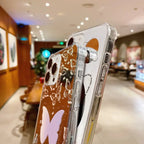 Protective iPhone 15 case with clean white background featuring "outer space" text and reflective circular mirror element
