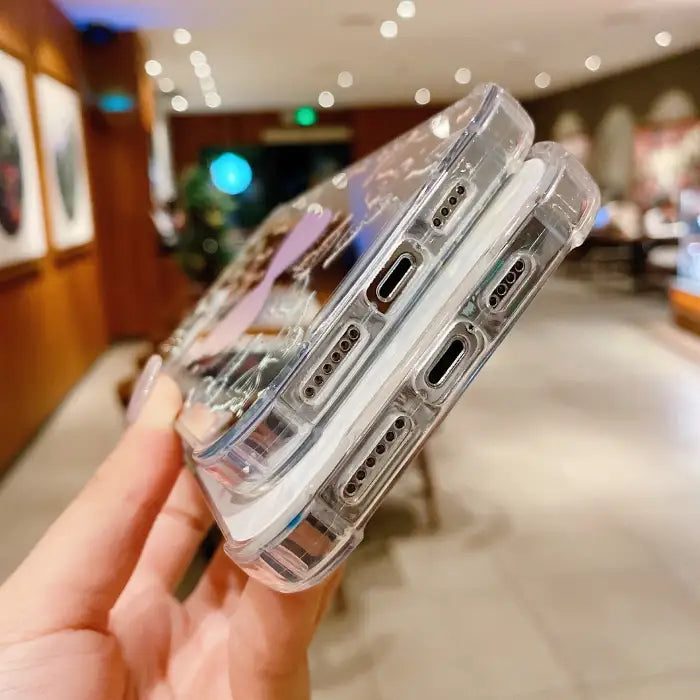 Protective iPhone 15 case showing side view with precise port cutouts and reinforced edges demonstrating impact protection features