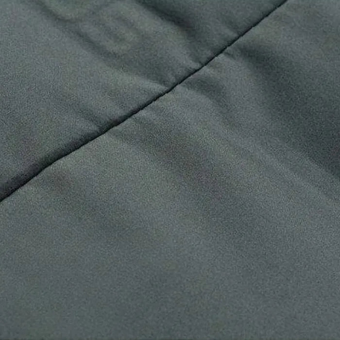 Puffer Blazer Jacket close-up of smooth stitched padding in charcoal grey for insulated structure.