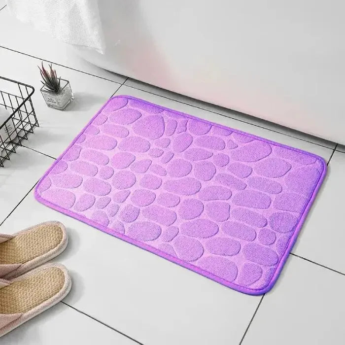 Purple bathroom mat, adds a pop of color to bathroom floors.