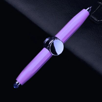 Purple fidget spinner pen with a smooth, reflective centerpiece on a dark backdrop.