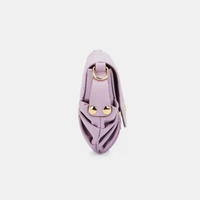 Designer lilac shoulder bag side profile featuring gold studs and decorative pleating details for luxury accessories