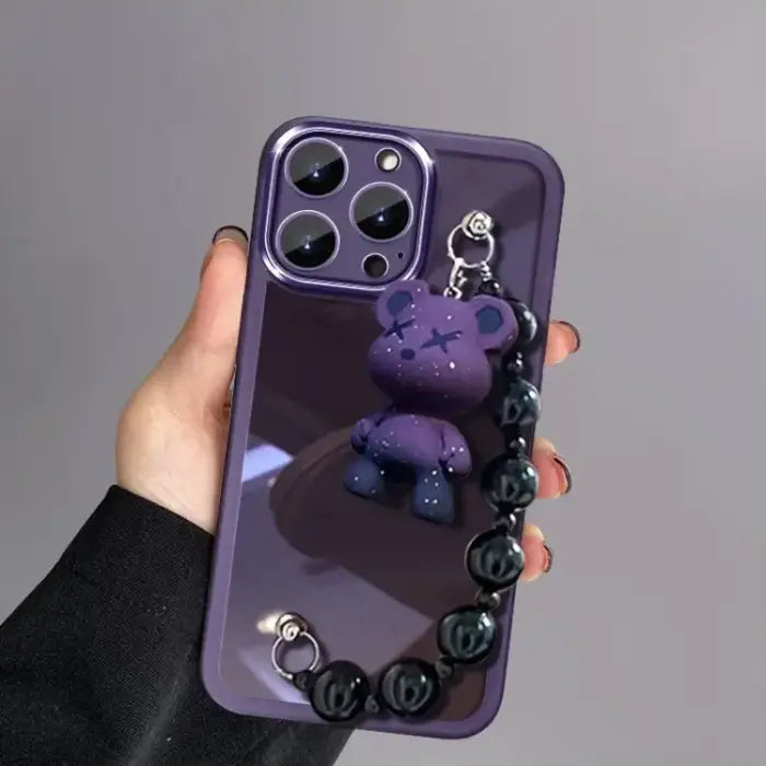Purple Kuwaii Phone Case featuring small bear keychain and glossy black bead strap design.