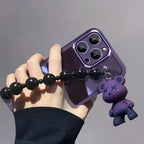 Close-up of Purple Kuwaii Phone Case showing purple bear charm and shiny black bead strap.