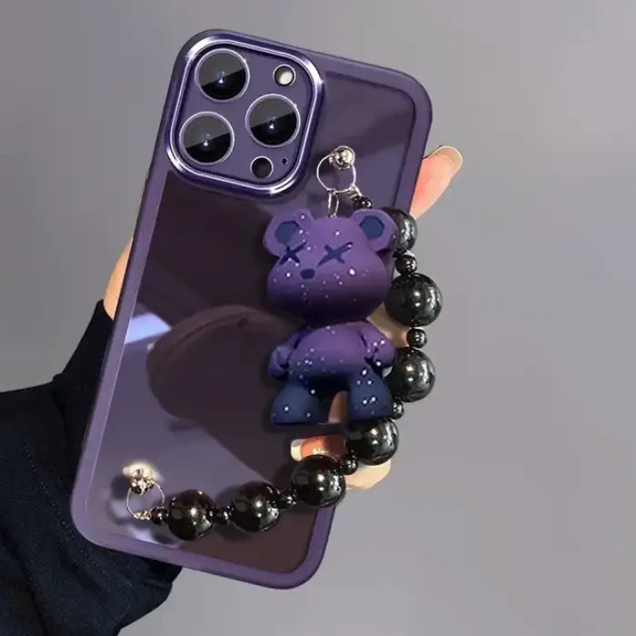 Purple Kuwaii Phone Case featuring adorable bear accessory and black glossy beaded handle.