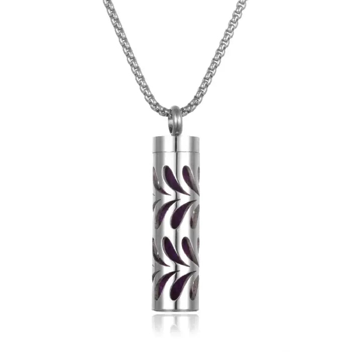 Aromatherapy pendant with purple leaf design, made of stainless steel for essential oil diffusion.