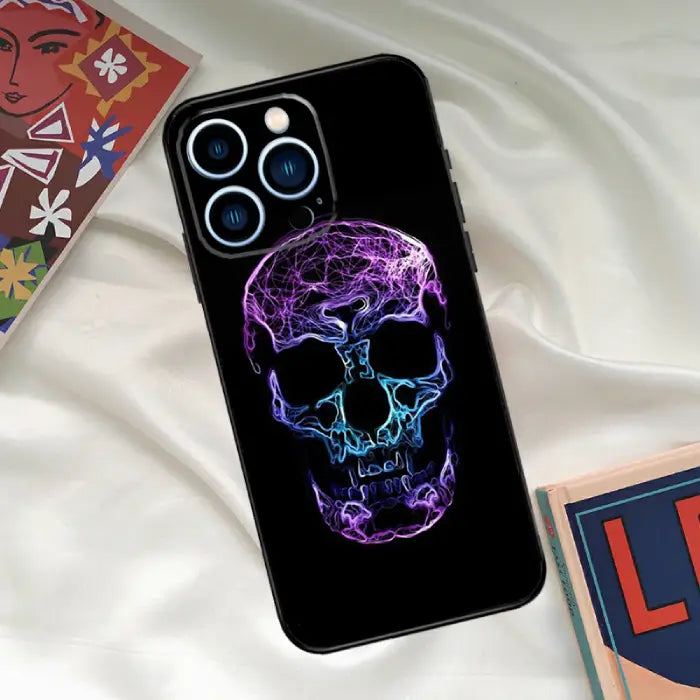 Purple neon skull phone case with glowing electric design, modern and eye-catching style accessory.