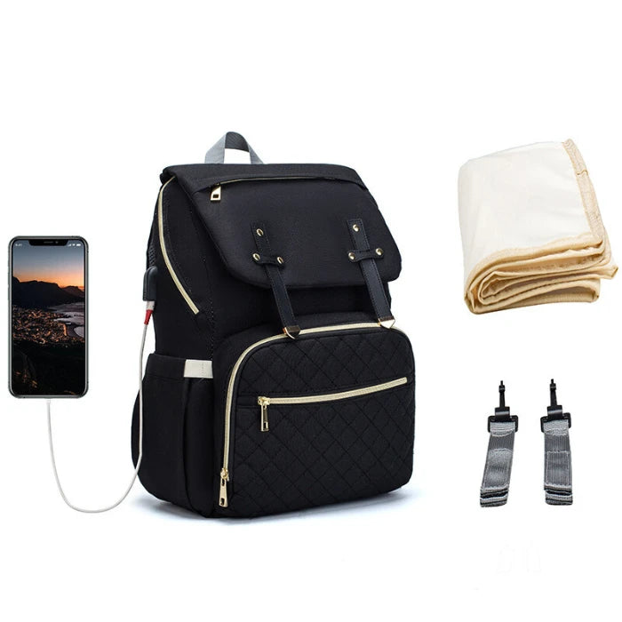 Luxury quilted diaper backpack featuring USB charging, stroller straps and blanket storage for stylish parents