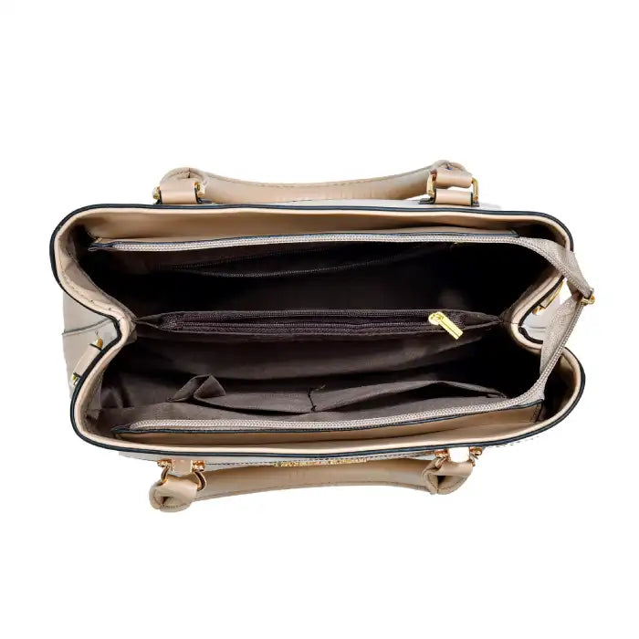 Quilted faux leather satchel handbag interior with multiple compartments, zippered section, organized storage view.