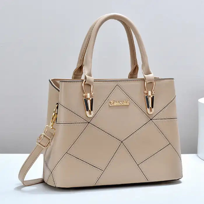 Quilted faux leather satchel handbag in khaki with diamond stitching, dual handles, gold hardware, front view.