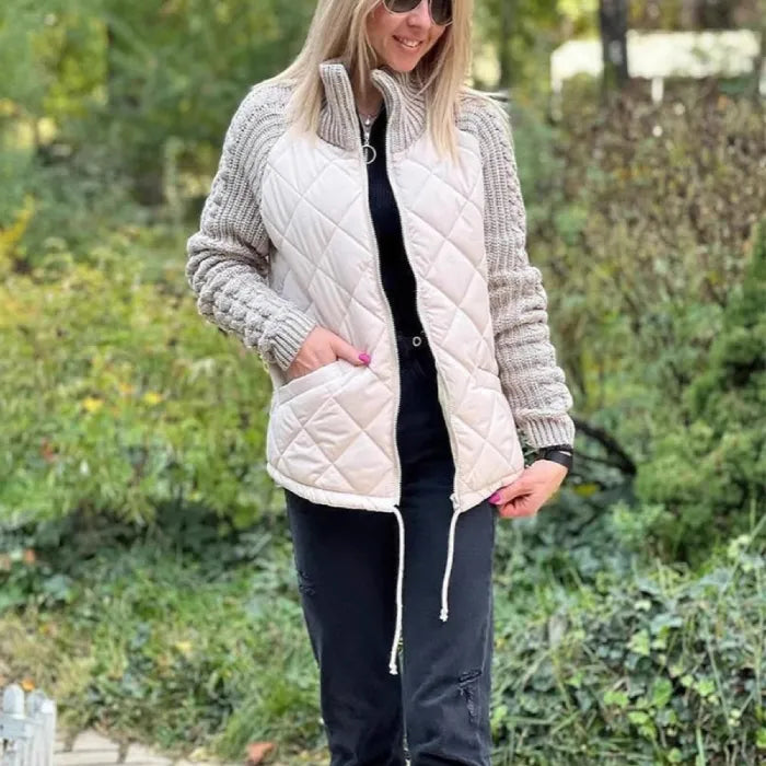 Quilted jacket with ivory quilted front and ribbed knit sleeves, zip closure and pockets for comfortable everyday wear