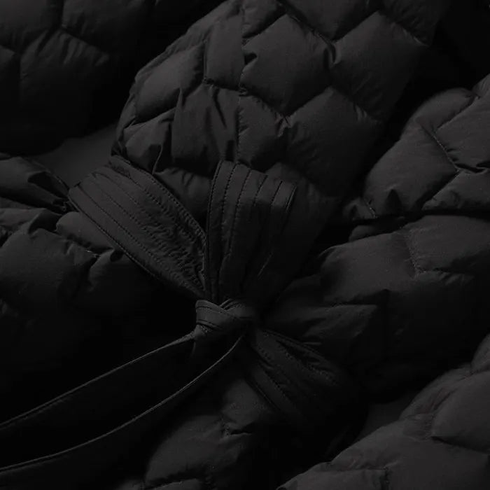 Quilted puffer jacket black waist-tie detail with thick quilt texture, offering warm premium winter coat style for fashion buyers