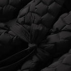 Quilted puffer jacket black waist-tie detail with thick quilt texture, offering warm premium winter coat style for fashion buyers
