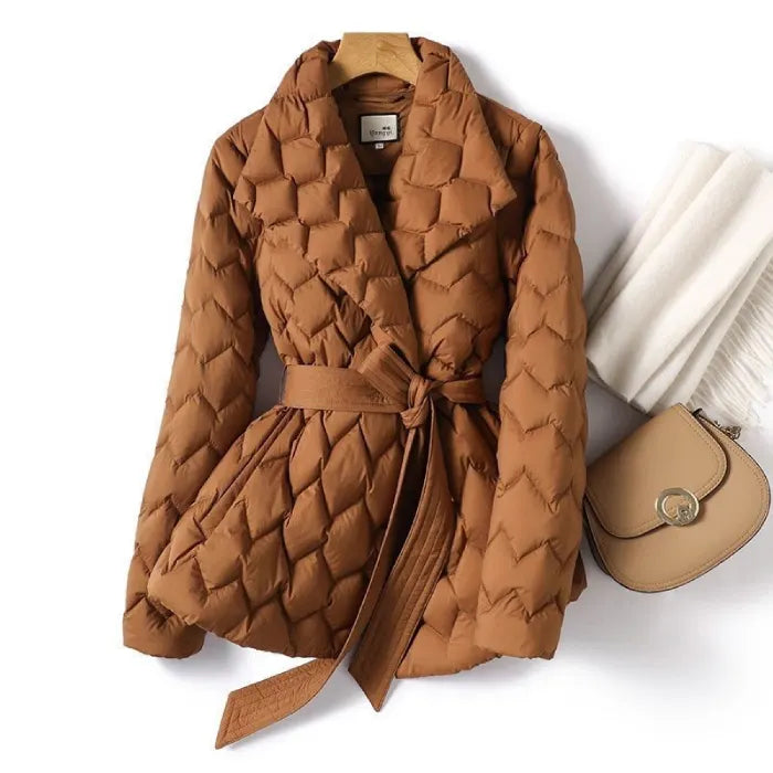 Quilted puffer jacket in caramel with belted waist and textured pattern, offering warm premium winter coat style for outings