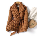 Quilted puffer jacket in caramel with belted waist and textured pattern, offering warm premium winter coat style for outings