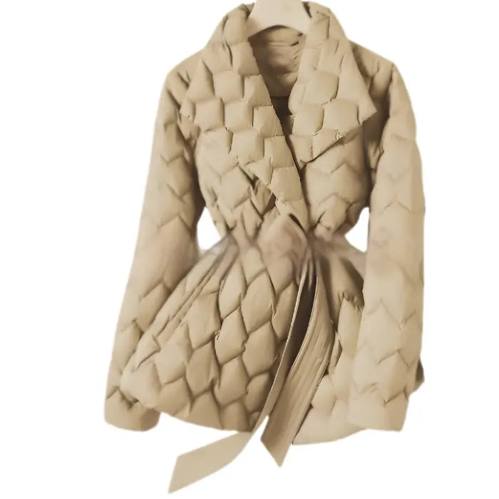 Quilted puffer jacket beige color with soft quilt texture and belted waist, offering warm stylish winter coat appeal for shoppers