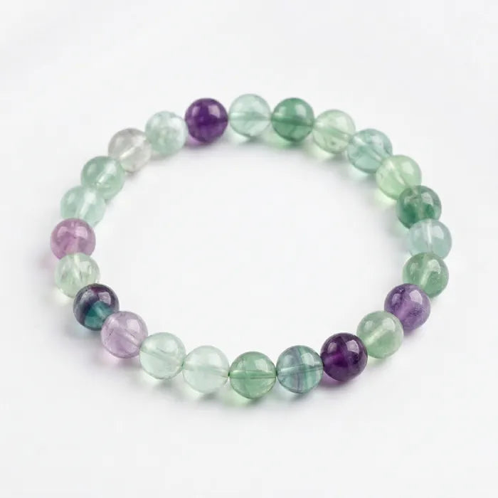 Rainbow Fluorite Crystal Bracelet featuring translucent green and purple beads, elegant clarity enhancing calming energy and focus