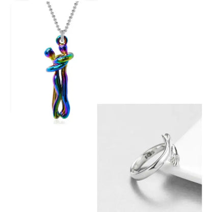 Rainbow-colored couple hug pendant necklace with a sleek silver hand embrace ring for unique jewelry lovers.