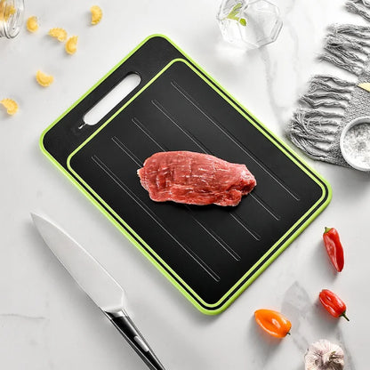 Raw steak on black and green cutting board with kitchen ingredients around.