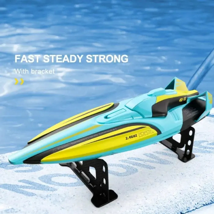 rc speed boat displayed on included bracket stand; fast, steady and strong design shows sleek hull lines by the pool. yay
