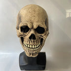Realistic Halloween tan skull mask with grinning teeth on a black stand for display or decor.
