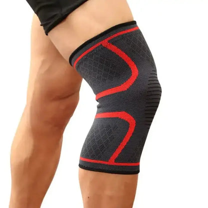  Black knee support sleeve with bold red geometric pattern, worn on leg showcasing fit and support features