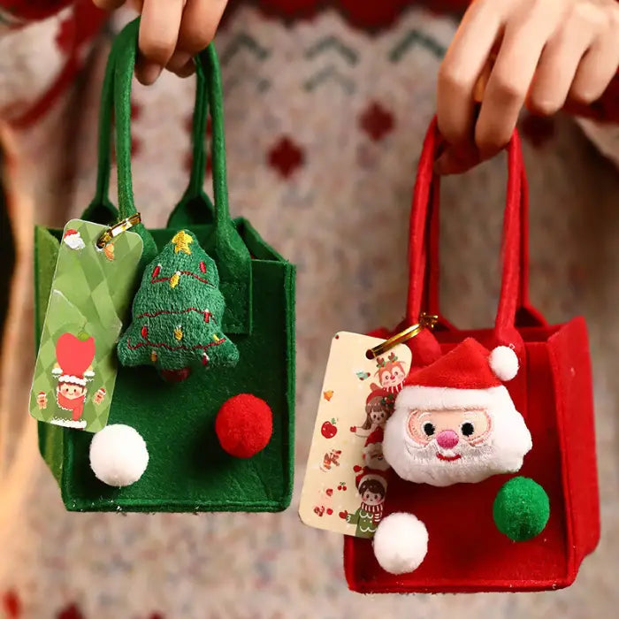 Red and green Christmas gift bags with Santa and tree ornaments, pom-poms, and festive tags.