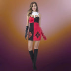 Red black harlequin dress with smile pose showing off contrasting diamond pattern and sleek silhouette.
