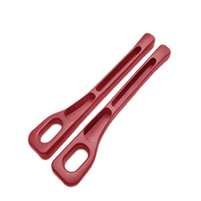 Pair of red plastic car seat gap fillers featuring ergonomic design with storage slots