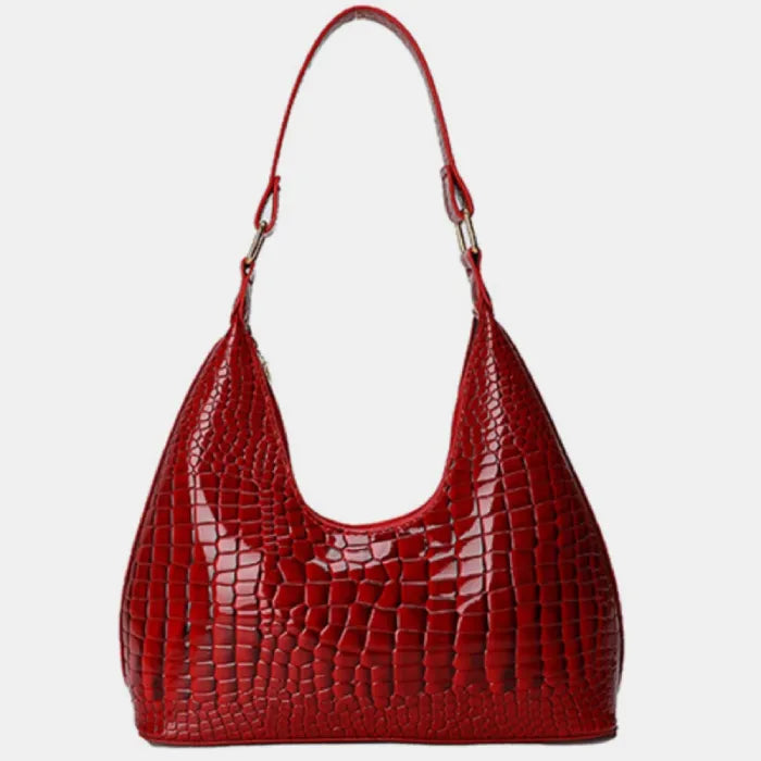 Bright red crocodile-embossed leather hobo handbag with curved shape and single strap