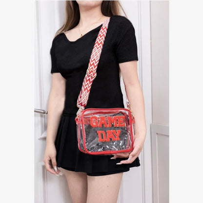 Clear stadium crossbody bag with red trim and Game Day text modeled with black dress for sports events